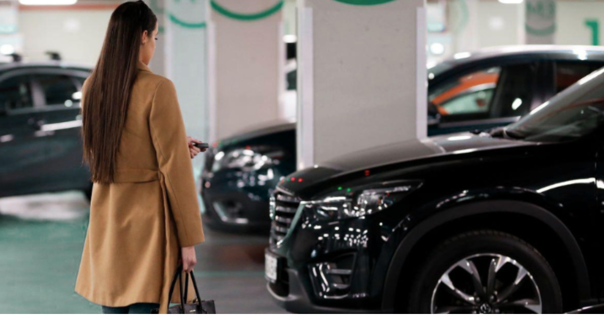 Woman practicing situational awareness while walking through a parking garage as part of real-world readiness for women. real-world readiness
